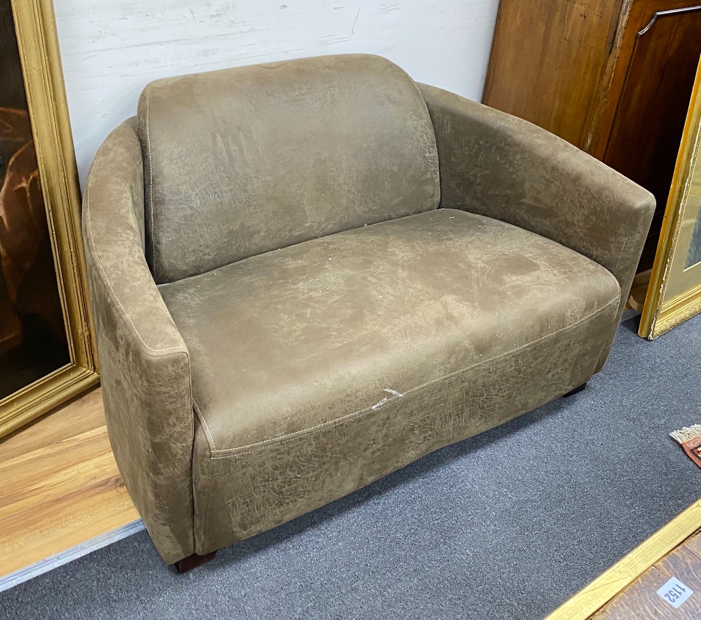 A pair of contemporary brown leather two seater settees, length 124cm, depth 80cm, height 70cm